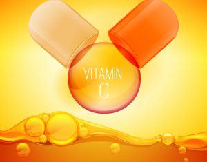 Open pilll with vitamin C. Shining golden essence circle droplet. Vector illustration in orange and yellow colours. Medical and pharmaceutical image.